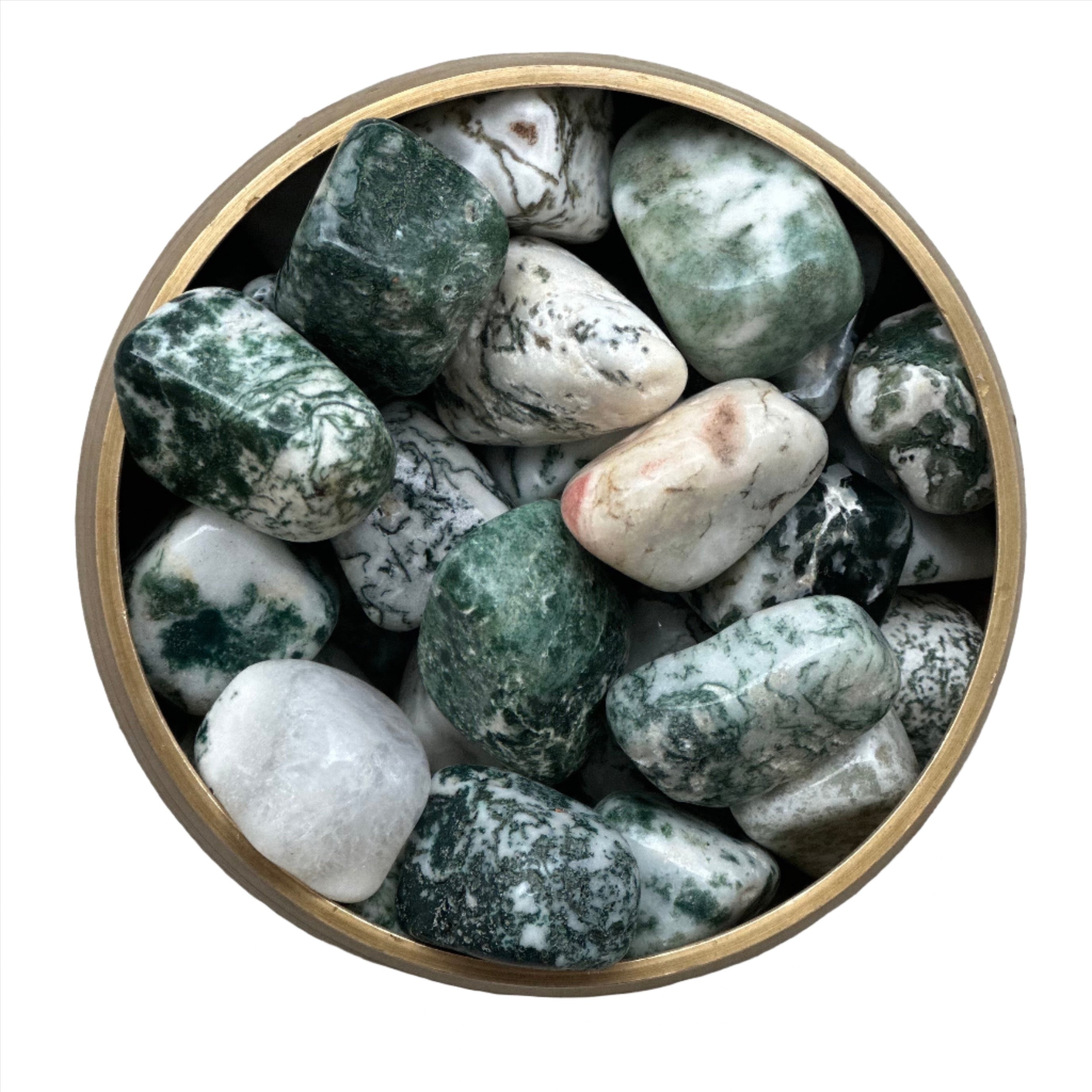 Moss agate tumbled stones in a bowl showcasing moss-like inclusions and vibrant green hues for healing and stress relief.