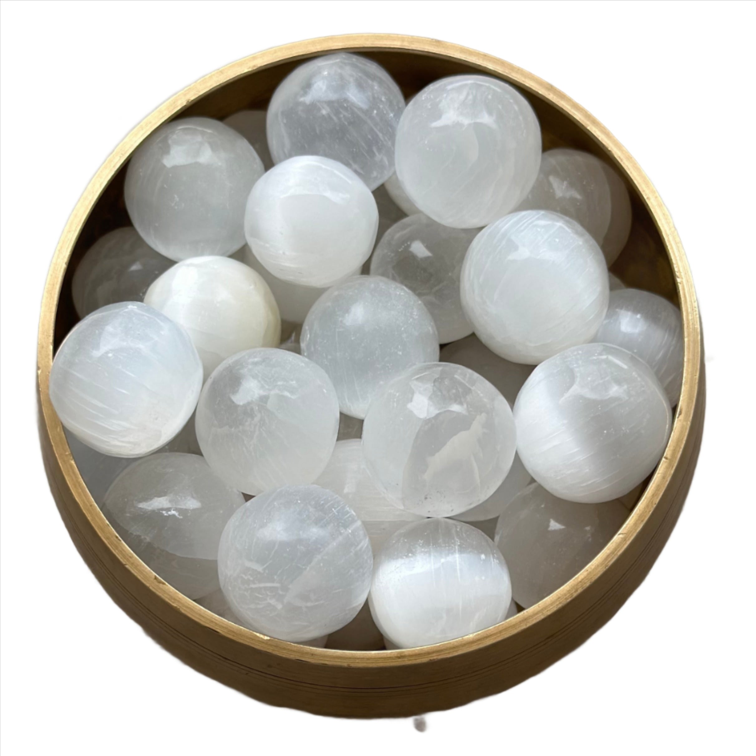 Bowl of polished selenite tumbled stones ideal for meditation and spiritual growth.