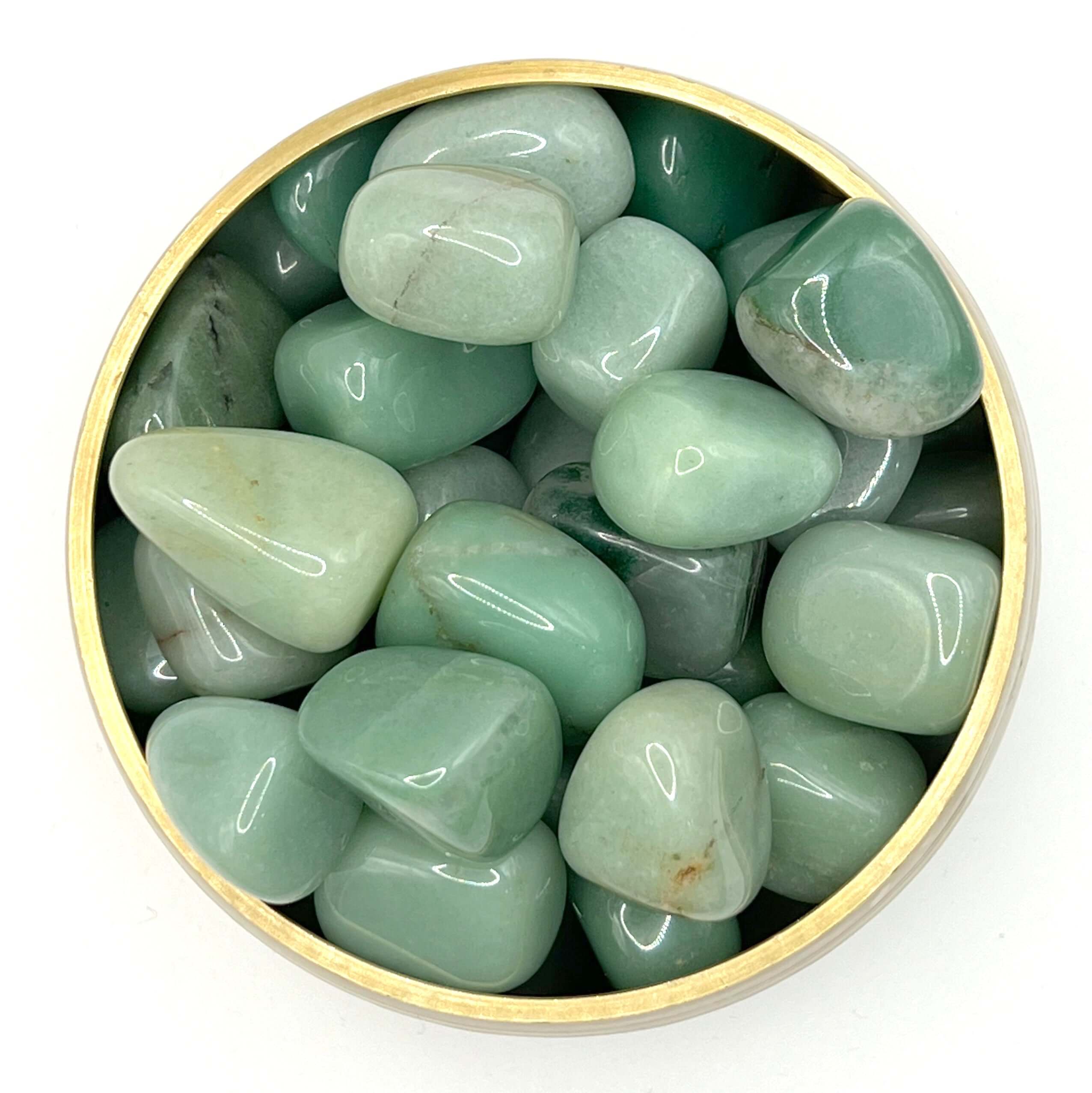 Green Aventurine tumbled stones in a round container, ideal for healing, balance, and promoting compassion and understanding.