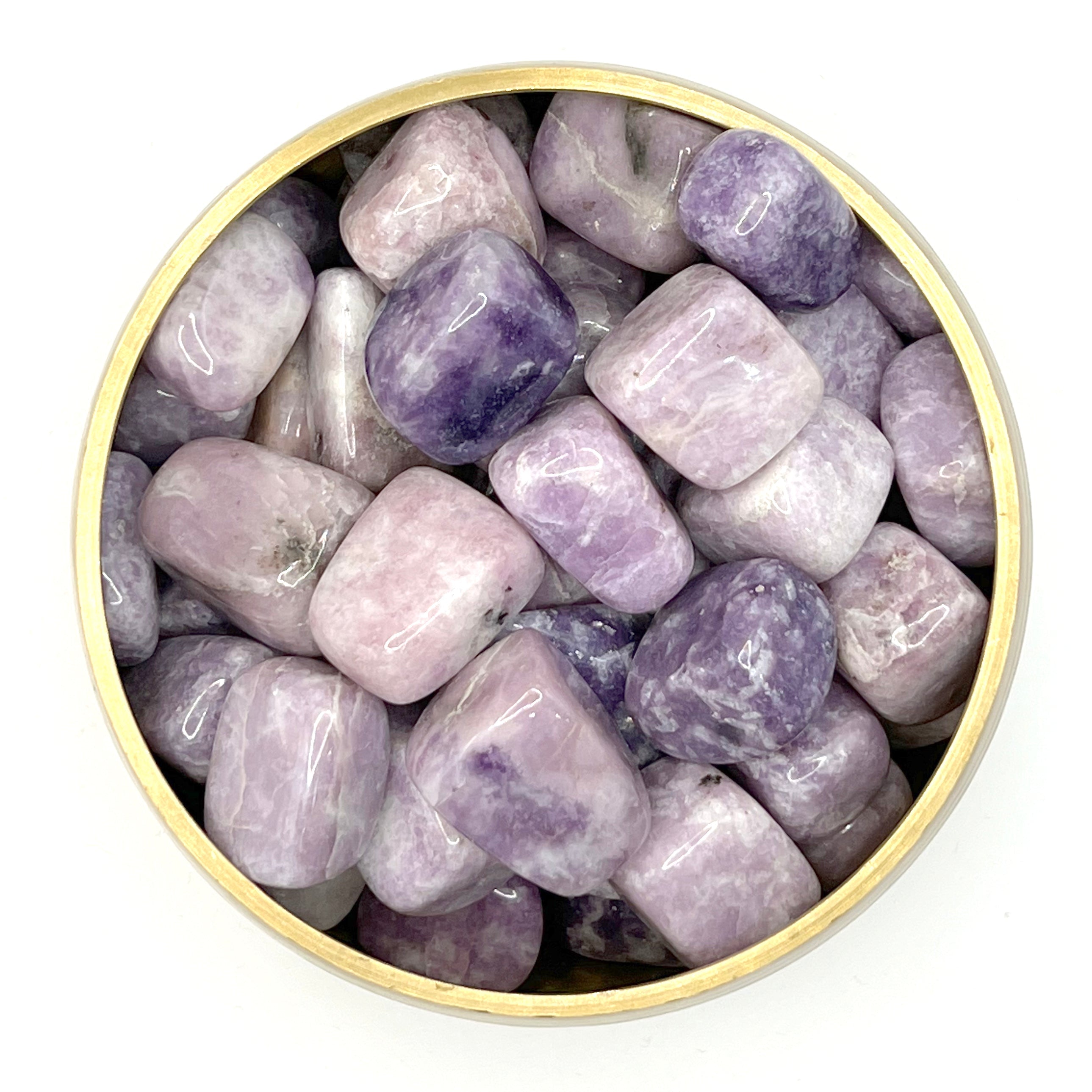Lepidolite tumbled stones in a bowl, beneficial for mood swings, radiation absorption, and emotional balance.