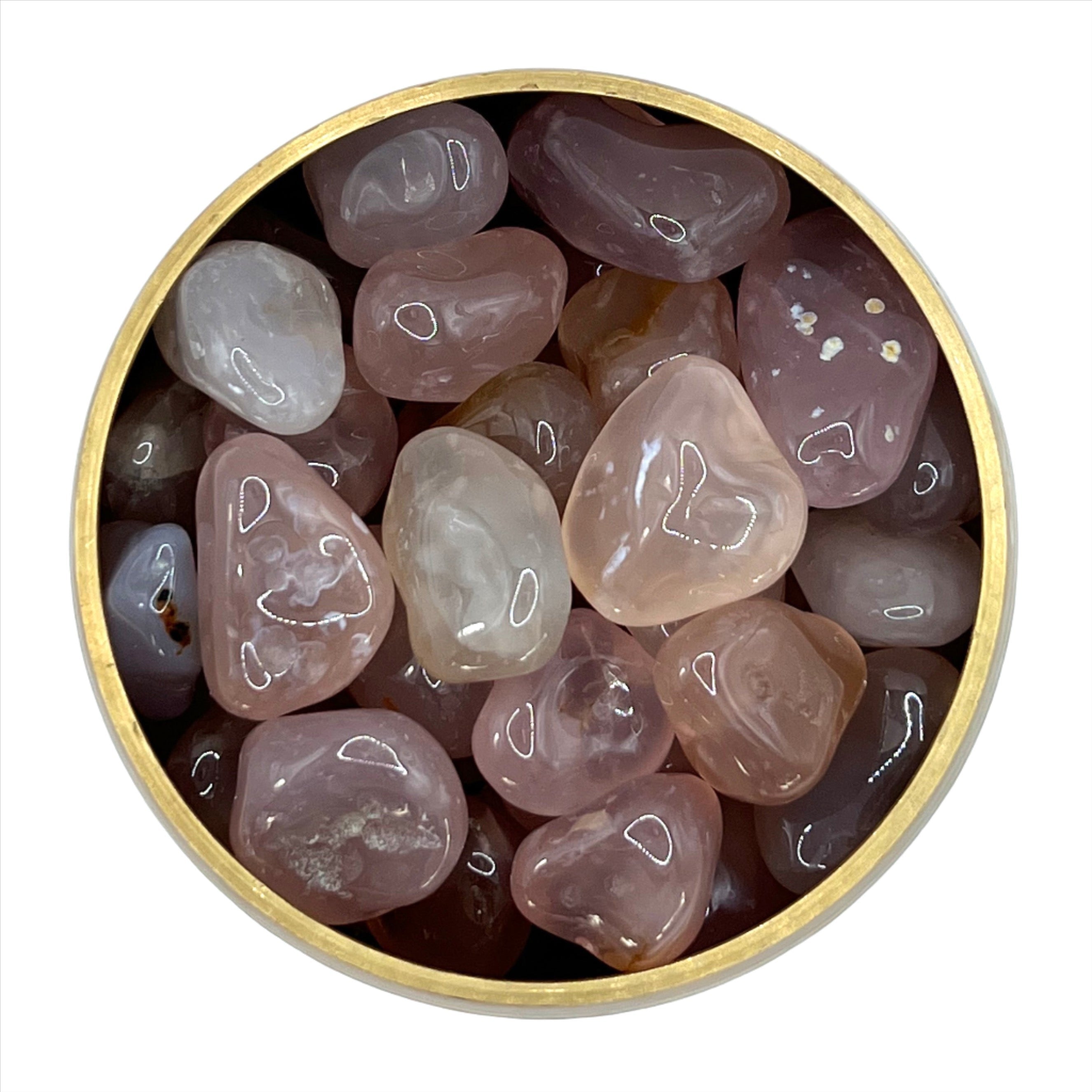 Pink Chalcedony tumbled stones in a round wooden bowl, showcasing their smooth texture and light pink hues.